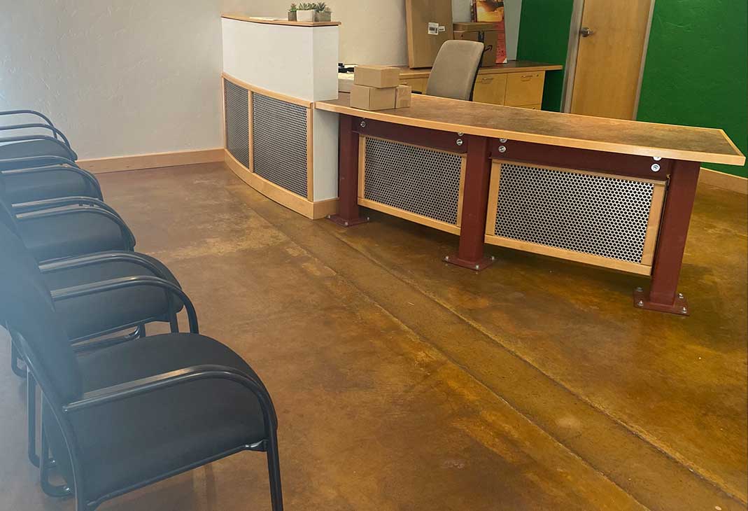 Reception desk and waiting-area chairs in the lobby